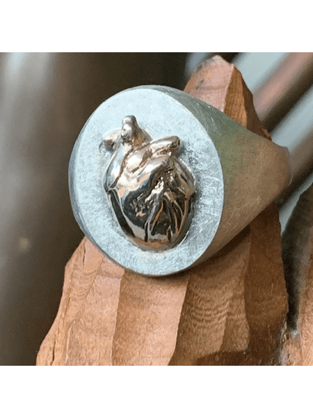 Handmade sterling silver ring with a unique sculpted heart design, crafted by local artisans in Melbourne, Australia. A truly one-of-a-kind piece.