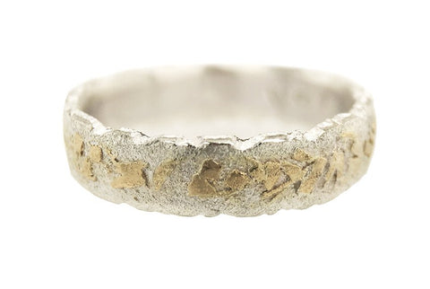 Boulder Terrain Edge men's wedding ring in sterling silver and gold, designed by Jeanette Dyke. A Melbourne-made piece with bold, textured edges.
