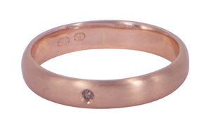 Low Dome men's wedding ring in 9ct rose gold with a champagne diamond, designed by Aimee Sutanto. Handmade in Melbourne with artisanal craftsmanship.
