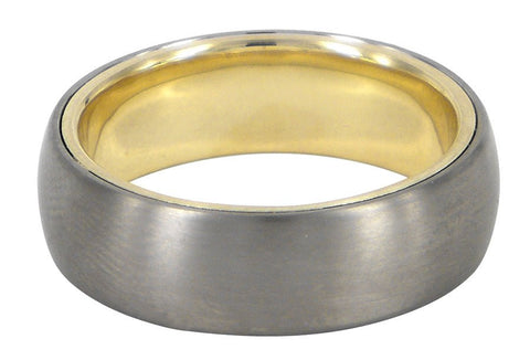 Heart of Gold men's wedding ring with a titaniumexterior and 9ct yellow gold interior, crafted by David Parker. A Melbourne-made piece with a unique contrast.