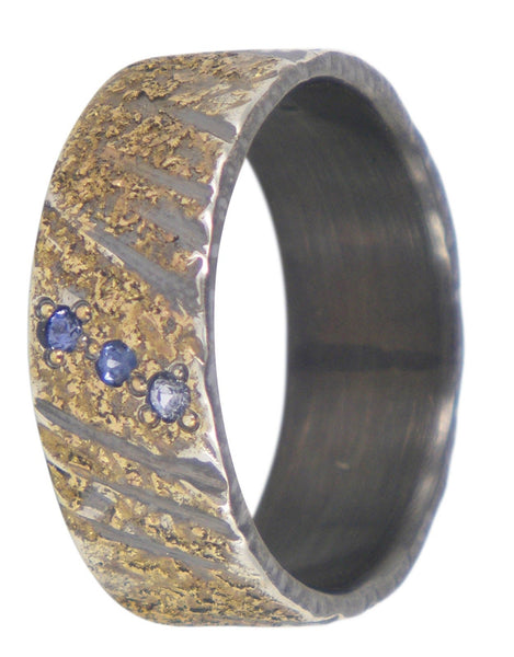 Handmade men's wedding ring by Jeanette Dyke in oxidised silver and gold, featuring 3 blue sapphires. Unique Melbourne-made Australian craftsmanship.