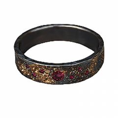 Galaxy men's wedding ring in oxidised sterling silver with rubies, designed by Jeanette Dyke. A Melbourne-made piece with vibrant and luxurious details.
