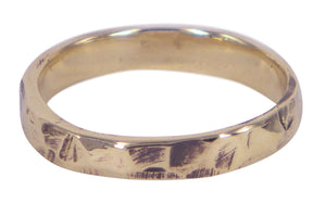 Handmade 9ct yellow gold men's wedding ring by Unnon, featuring a narrow, textured design. Melbourne-made, unique, Australian artisanal craftsmanship.